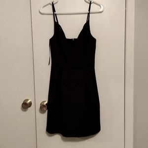 Black strap dress with accent "X"